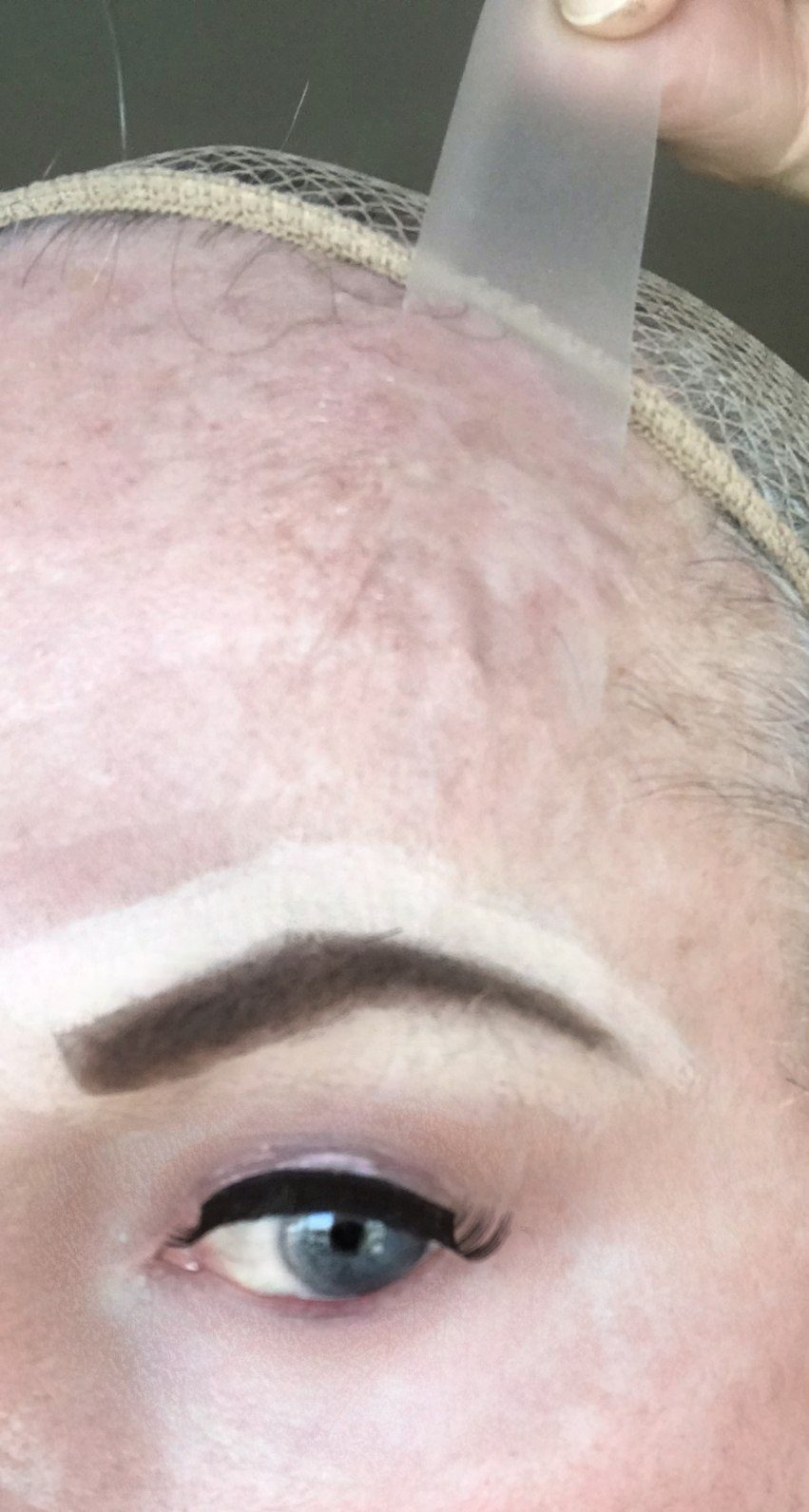 creating brow arch during crossdresser makeup